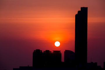 Sky with clouds over the evening city with sunset