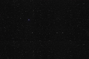 Black shiny mix of jewels texture background. Looks like starry night sky or space galaxy.