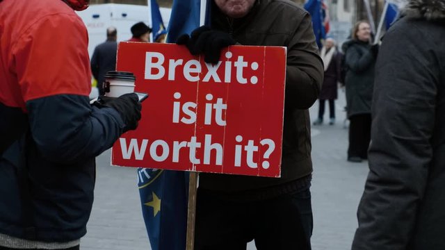 BREXIT - Close-up shot of a Pro-EU Remainer poster which reads Brexit, is it worth it, in Westminster, London, England, UK