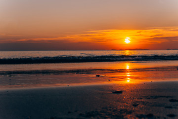 Fototapeta premium Beautiful blazing sunset landscape and orange sky above it,summer background.