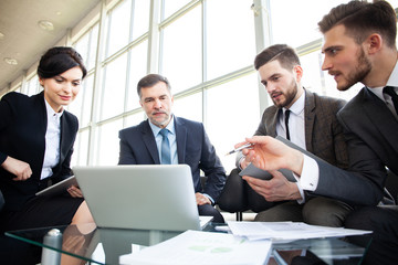 Corporate business team meeting in a modern open plan office