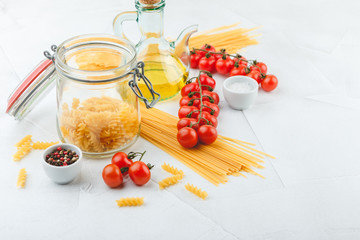 Naklejka na ściany i meble Italian Pasta with tomatoes, oil