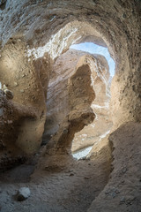A narrow slot canyon curved in twists and turns into the soft rock of the alluvial fan, Sidewinder Canyon, Death Valley National Park, California
