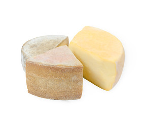 three cheers of cheese of different color on white background