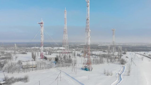 Aerial view frozen television towers in winter.