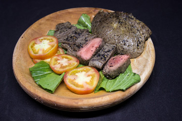 Medium Roast Steak on wooden plate 