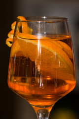 Refreshing cocktail with orange peel decoration