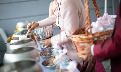 offer food to monk. Groom give alms food to a Buddhist monk in traditional thai wedding ceremony....