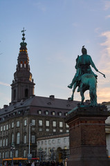 Fototapeta premium Copenhagen, tower of the baroque Christiansborg Palace and Statue of Absalon