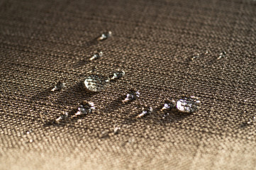Fototapeta na wymiar Water repellent and waterproof fabrics. How to waterproof fabric with these simple instructions for Experiment by drop water on it