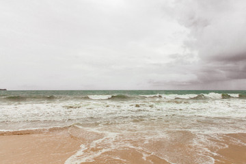 Stormy ocean coast with small waves in Bali, Jimbaran, Indonesia