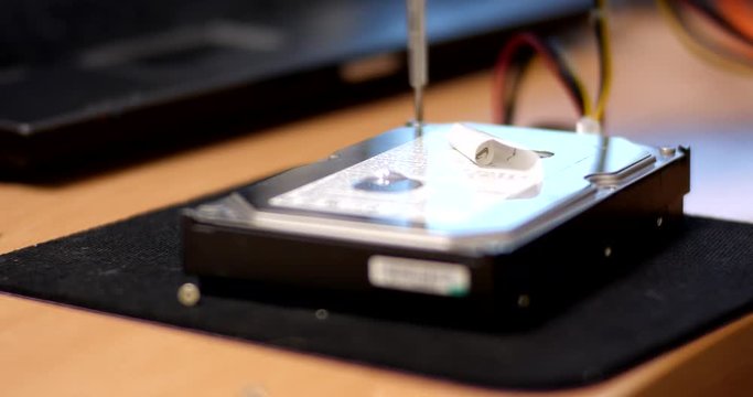 Close ups of an opening computer hard drive