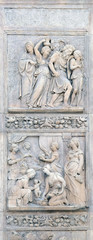 Escape of Loth by Niccolo Tribolo up and Birth of Esau and Jacob by Alfonso Lombardi down, left door of San Petronio Basilica in Bologna, Italy