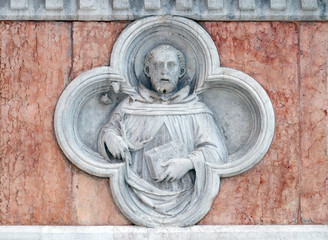Saint Dominic by Paolo di Bonaiuto relief on facade of the San Petronio Basilica in Bologna, Italy