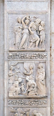 Escape of Loth by Niccolo Tribolo up and Birth of Esau and Jacob by Alfonso Lombardi down, left door of San Petronio Basilica in Bologna, Italy