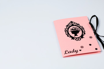 Making greeting card from paper, cardboard and tape.