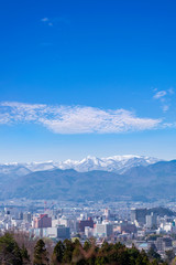Fukushima cityscape view from Hanamiyama park, in Fukushima, Tohoku area, Japan. The park is very famous Sakura view spot