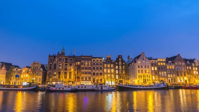 Amsterdam Netherlands time lapse 4K, city skyline day to night timelapse at canal waterfront