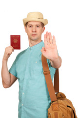 The man with the international passport holds a palm before himself, gesture - stop