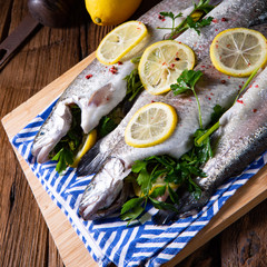 fresh trout with lemon and different herbs
