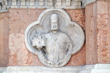 Saint Petronio by Giovanni di Riguzzo relief on facade of the San Petronio Basilica in Bologna, Italy