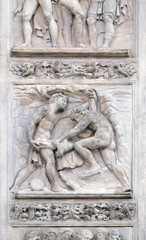 The brothers tinged Joseph's coat with the blood by Giacomo Raibolini, right door of San Petronio Basilica in Bologna, Italy