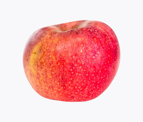 whole ripe red apple fruit on plate on white