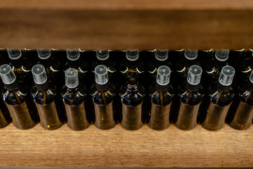 Set of glass dark brown bottles  for cosmetics and medicine products