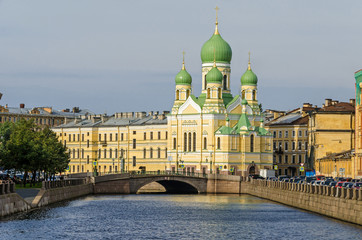 Griboyedov Canal embankment with the  Mogilyovsky Bridge and the St.Isidore Church in...