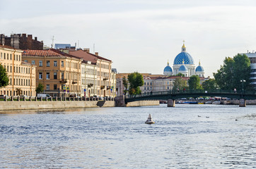 Fontanka river embankment, the English Bridge and the Trinity Cathedral in St.Petersburg, Russia