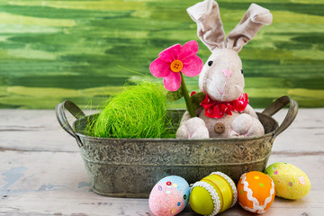 Easter rabbit and eggs with colorful eggs around and white background