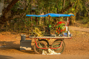 indian mobile sugar cane juicer. street food