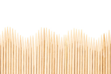 Bamboo toothpicks are placed in parallel - backgrounds, textures. Bamboo toothpicks isolated on white background - obrazy, fototapety, plakaty
