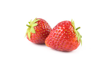 Two strawberries close up on white background.