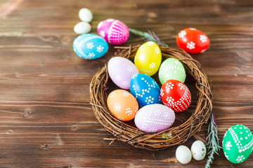 bright early colored easter eggs wooden background