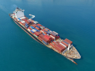 Aerial view container ship full load container for logistic, import export, shipping or transportation.