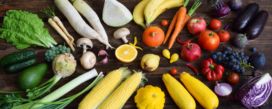 White, Yellow, Green, Orange, Red, Purple Fruits And Vegetables On Wooden Background.  Healthy Food. Multicolored Raw Food.