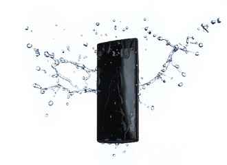 Smartphone with splashing of water or explosion flying in the air isolated on white background