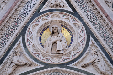Our Lady of Sorrows supported by Angels bearing Flowers, Portal of Cattedrale di Santa Maria del Fiore (Cathedral of Saint Mary of the Flower), Florence, Italy 