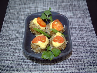 meatballs with rice and vegetables on a plate