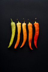 Red Chilli Peppers On Black Background