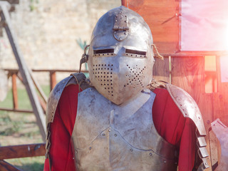 Naklejka premium knight's armor in the sun in the summer outdoors