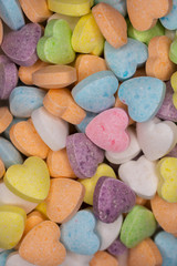 Obraz na płótnie Canvas candy, love hart colorful closeup with background