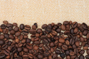Coffee beans on the textile and copy space