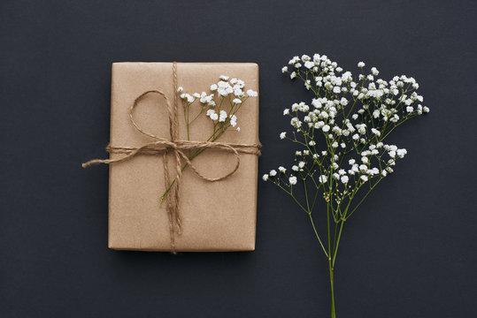 Making something special... Close-up image of beautiful gift box decorated with flowers
