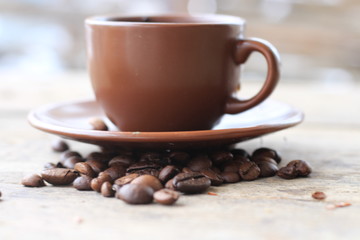 a cup of coffee and coffee beans