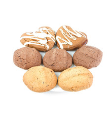 various cookies on a white plate on white background