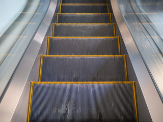 Fototapeta premium modern yellow line escalator in shopping mall