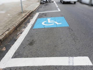 Space reserved for car parking for people with physical disabilities icon designed on the floor for...