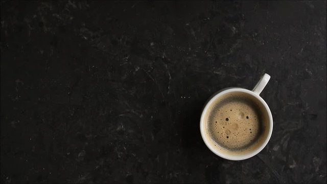 coffee Espresso in a white cup (top view) cooking process. Top Food background